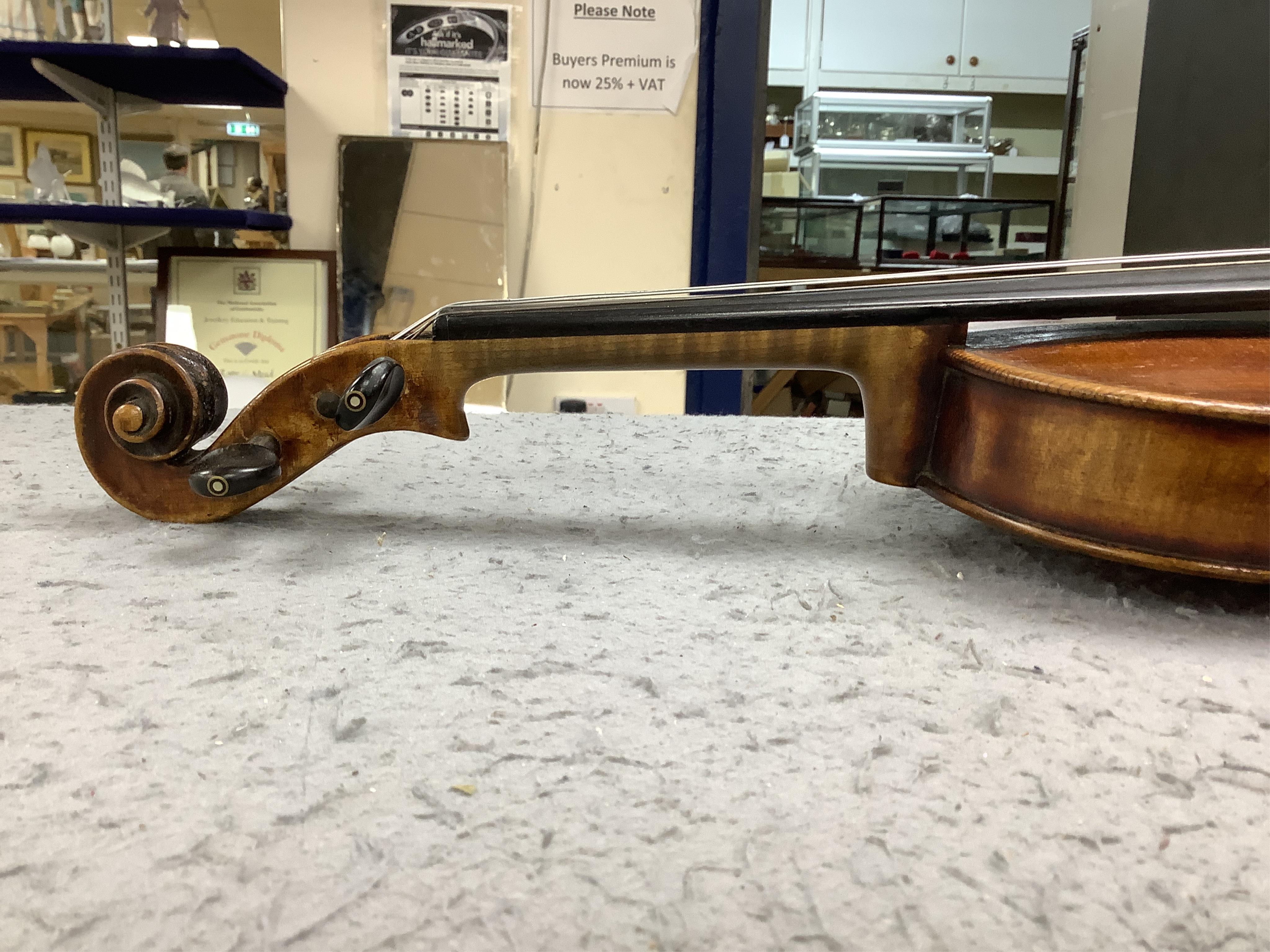 A cased 19th century English violin, with label reading George Craske, Fecit 1842, Edward Crompton, 54, Barton Arcade, Deansgate, Manchester, body length 36cm. Condition - fair to good.